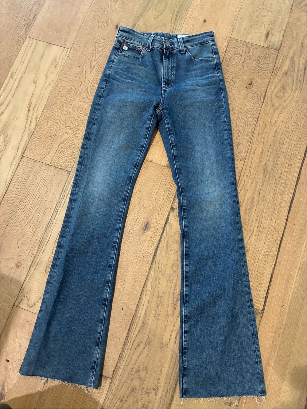 High-Rise Blue Flare Jeans with Raw Hem